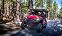 The Pioneer 1000-5's large, rugged aluminum wheels and 27-inch radial tires on craggy terrain 