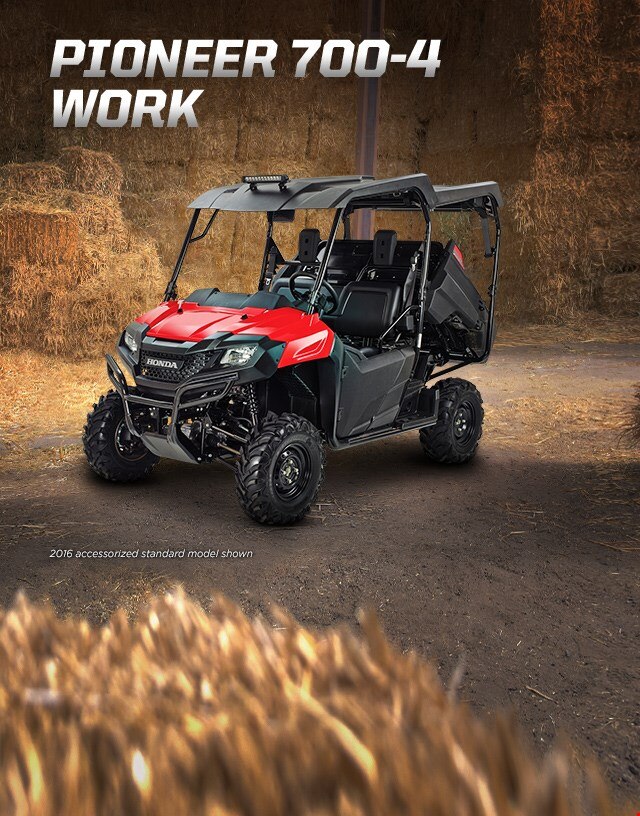 Pioneer 700-4 Work. Haul more, go further. Image of Pioneer vehicle in a barn.