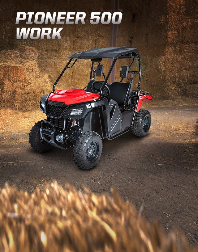 Pioneer 500 Work. Adventures anywhere. Compact side-by-side parked in hay barn
