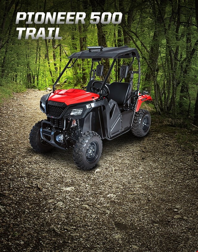 Pioneer 500 Trail. Adventures anywhere. Side-by-side equipped with hard roof and light bar ready to explore deep forested trail