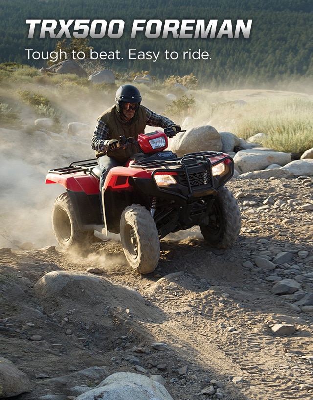 TRX500 Foreman. Tough to beat. Easy to ride. Image of tough ATV rider driving up rugged terrain with a trail of dust behind.