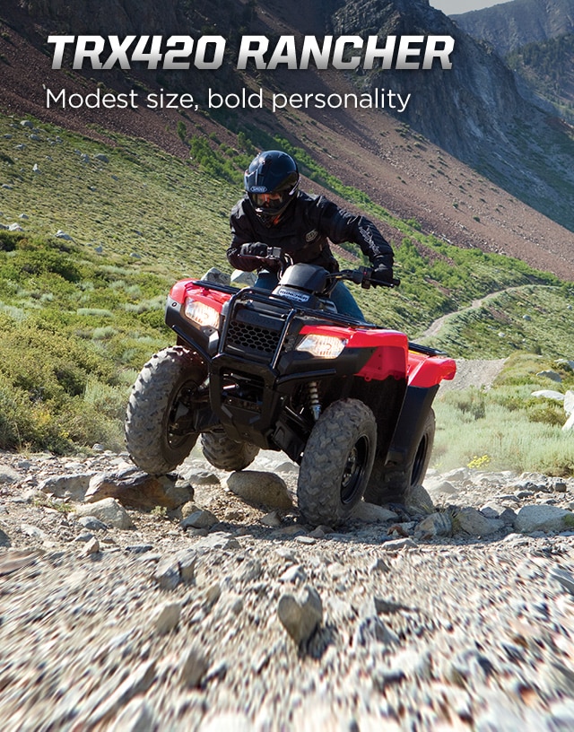 TRX420 Rancher. Modest size, bold personality. Image of rider on ATV manouevering over large rocks on a rugged trail incline.