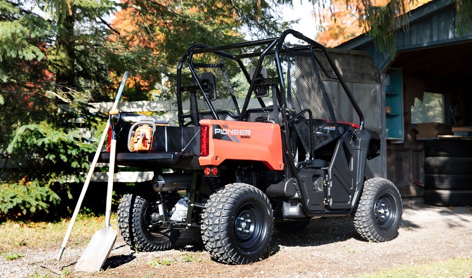 Pioneer 520 with tools for yard work