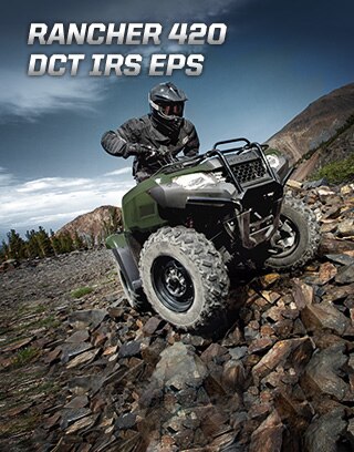 TRX420 Rancher DCT IRS EPS. Master of work and play. Image of white ATV parked in lush green forest.