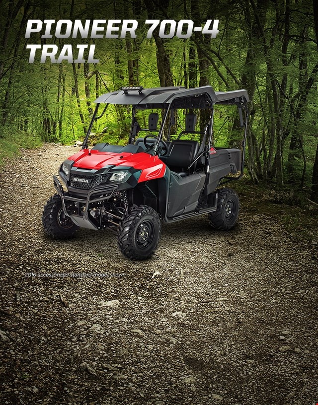 Pioneer 700-4 Trail. Haul more, go further. Image of Pioneer vehicle in the forest.