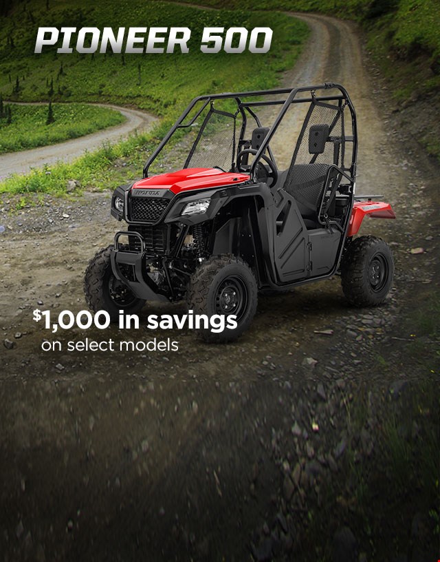 Pioneer 500. Adventures anywhere. Image of compact side-by-side speeding through rocky, muddy creek in the forest