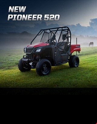 Pioneer 500. Adventures anywhere. Image of compact side-by-side speeding through rocky, muddy creek in the forest
