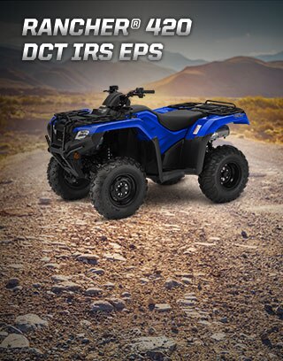 TRX420 Rancher DCT IRS EPS. Master of work and play. Image of white ATV parked in lush green forest.