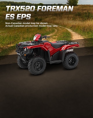 TRX500 Foreman ES EPS. The limitless legend. Image of orange ATV dramatically parked on gravel trail with majestic mountain peaks in background. 